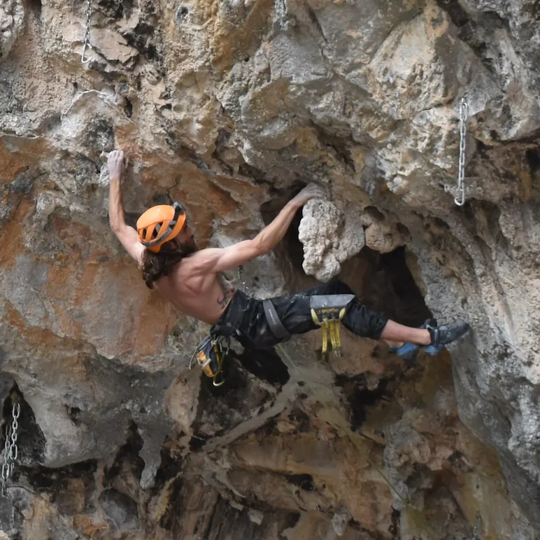 Boulderer in a cave