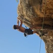 Climber on an orange overhang